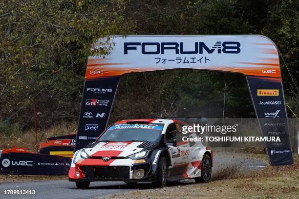 Takamoto Katsuta of Japan and his co-driver Aaron Johnston of Ireland drive their Toyota GR Yaris Rally1 Hybrid crossing the finish line at the SS14...