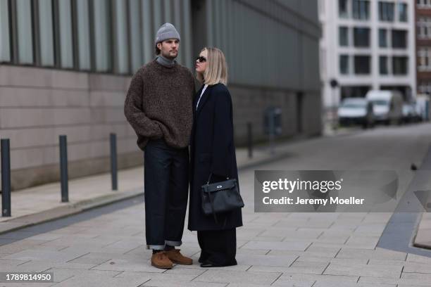 Felix Hartmann seen wearing Acne Studios grey beanie / hat, Allude grey cashmere turtleneck, by Aylin Koenig brown wool knit sweater, COS dark blue...