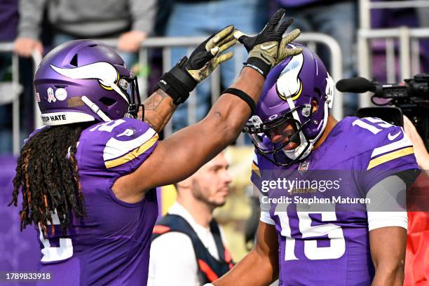 Joshua Dobbs of the Minnesota Vikings celebrates his touchdown with teammate Alexander Mattison against the New Orleans Saints during the second...