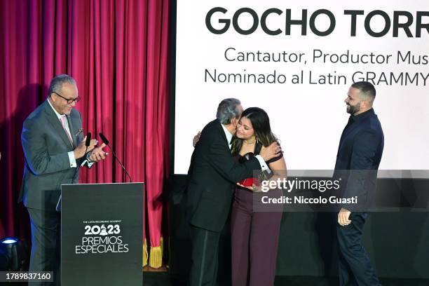 Manuel Tejada, honoree Wilson Torres, Cherry Torres, and Gocho Torres speak onstage during the 2023 Latin GRAMMY Special Awards Presentation at...