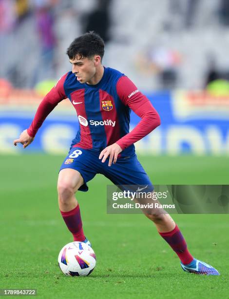 Pedri of FC Barcelona runs with the ball during the LaLiga EA Sports match between FC Barcelona and Deportivo Alaves at Estadi Olimpic Lluis Companys...