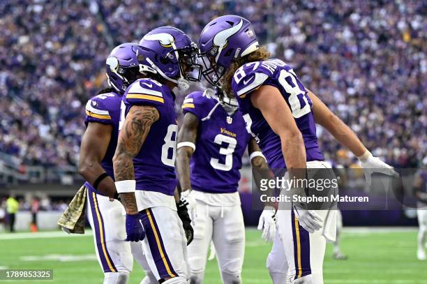 Hockenson of the Minnesota Vikings celebrates with Jalen Nailor after scoring a touchdown against the New Orleans Saints during the second quarter at...