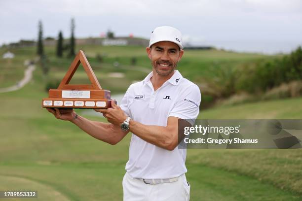 Camilo Villegas of Colombia poses with the trophy after winning the Butterfield Bermuda Championship at Port Royal Golf Course on November 12, 2023...