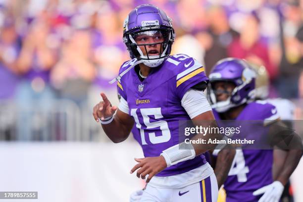 Joshua Dobbs of the Minnesota Vikings celebrates scoring a rushing touchdown against the New Orleans Saints during the second quarter at U.S. Bank...