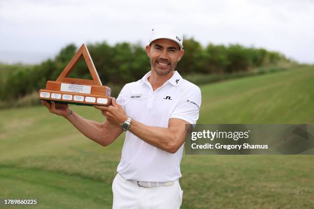 Camilo Villegas of Colombia poses with the trophy after winning the Butterfield Bermuda Championship at Port Royal Golf Course on November 12, 2023...