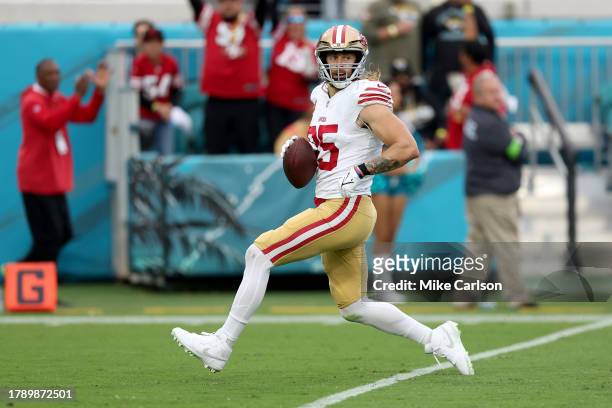 George Kittle of the San Francisco 49ers runs into the end zone for a touchdown during the third quarter against the Jacksonville Jaguars at EverBank...