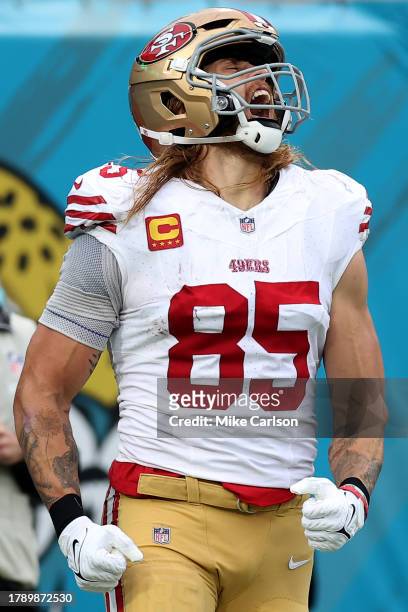 George Kittle of the San Francisco 49ers reacts after a touchdown during the third quarter against the Jacksonville Jaguars at EverBank Stadium on...