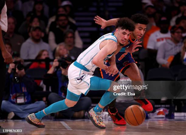 LaMelo Ball of the Charlotte Hornets knocks the ball away from Quentin Grimes of the New York Knicks during the second half at Madison Square Garden...