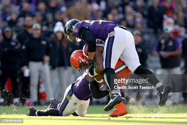 Deshaun Watson of the Cleveland Browns is tackled by Patrick Queen of the Baltimore Ravens and Kyle Van Noy during the second quarter at M&T Bank...