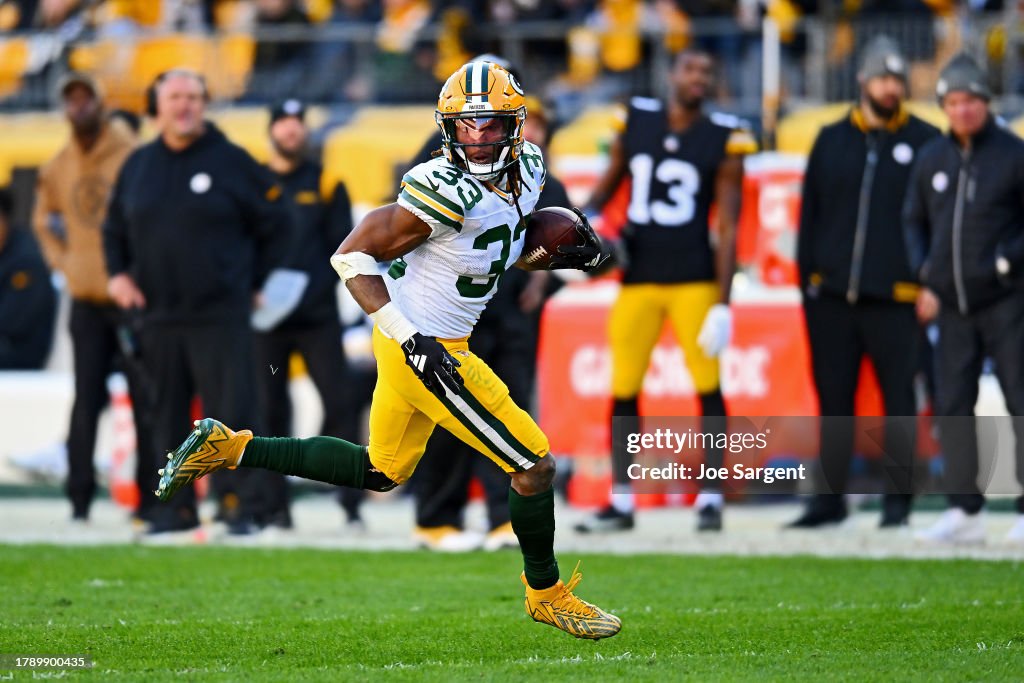 Aaron Jones of the Green Bay Packers runs the ball during the third