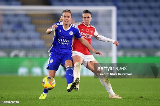 Lena Petermann of Leicester City battles for possession with Lotte Wubben-Moy of Arsenal during the Barclays Women´s Super League match between...