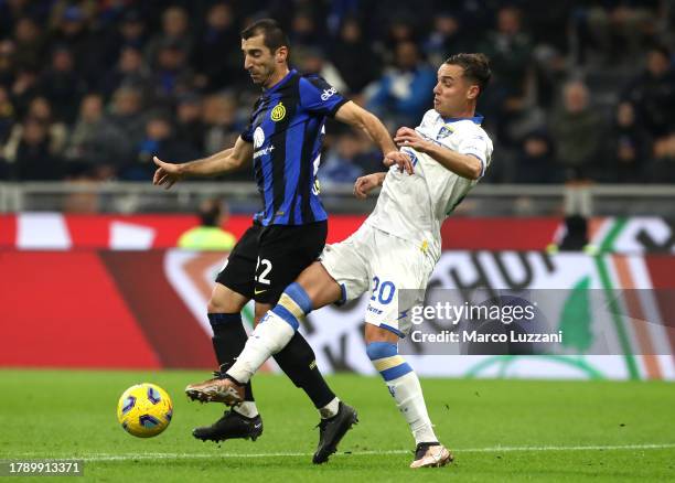 Henrikh Mkhitaryan of FC Internazionale is challenged by Pol Lirola of Frosinone Calcio during the Serie A TIM match between FC Internazionale and...