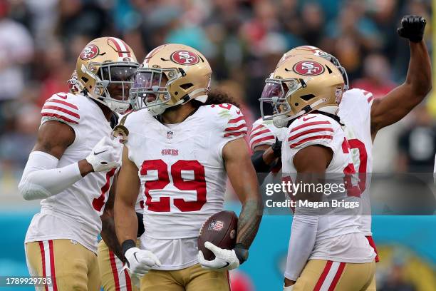 Talanoa Hufanga of the San Francisco 49ers celebrates an interception intended for Tank Bigsby of the Jacksonville Jaguars during the third quarter...