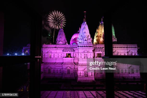 Fireworks explode in the sky above the domed architecture of Neasden Temple, also known as BAPS Shri Swaminarayan Mandir, during Diwali celebrations...