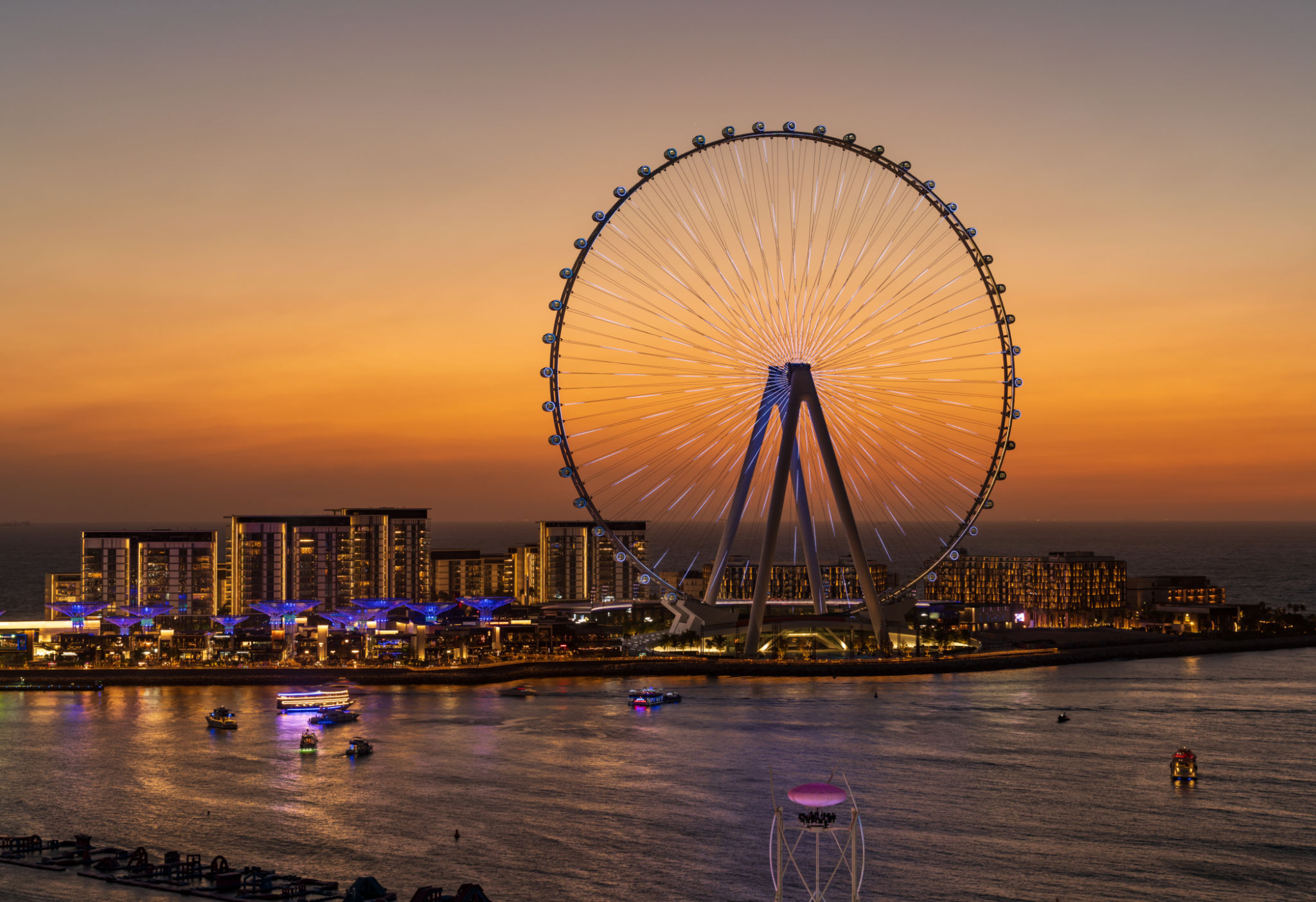 Light show on Ain Dubai observation wheel at sunset Light show on Ain Dubai observation wheel at sunset