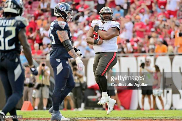 Vita Vea of the Tampa Bay Buccaneers reacts after a defensive play during the fourth quarter against the Tennessee Titans at Raymond James Stadium on...