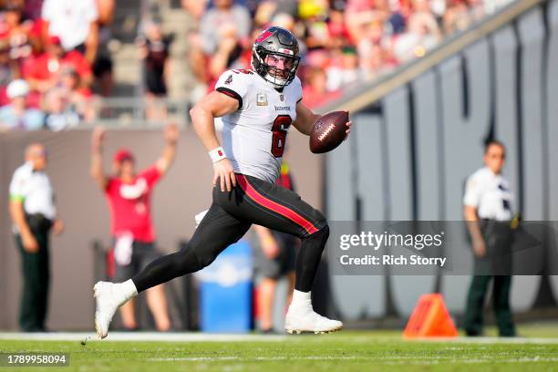 Baker Mayfield of the Tampa Bay Buccaneers runs the ball during the fourth quarter against the Tennessee Titans at Raymond James Stadium on November...