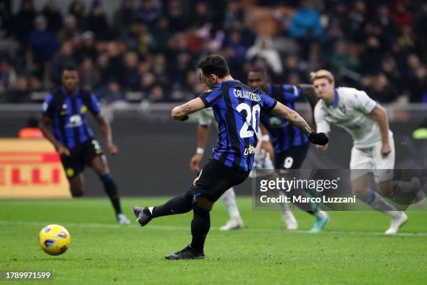Hakan Calhanoglu of FC Internazionale scores the team's second goal from the penalty spot during the Serie A TIM match between FC Internazionale and...