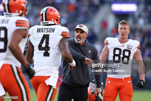 Head coach Kevin Stefanski of the Cleveland Browns celebrates with Deshaun Watson during the second half against the Baltimore Ravens at M&T Bank...