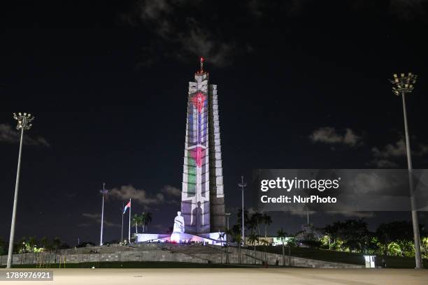 General view of the Jose Martí Memorial adorned with illuminated Cuban and Palestinian flags, on November 17 in Havana, Cuba. Cuban President Miguel...