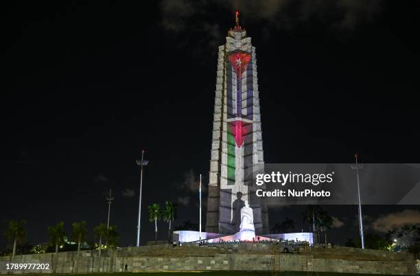 General view of the Jose Martí Memorial adorned with illuminated Cuban and Palestinian flags, on November 17 in Havana, Cuba. Cuban President Miguel...