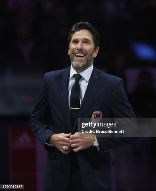 Henrik Lundqvist is given his Hockey Hall of Fame blazer from Lanny McDonald at Air Canada Centre on November 12, 2023 in Toronto, Ontario, Canada.