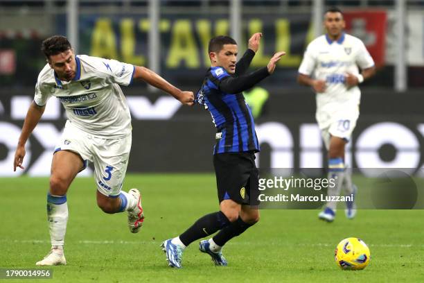 Stefano Sensi of FC Internazionale is held by Riccardo Marchizza of Frosinone Calcio during the Serie A TIM match between FC Internazionale and...