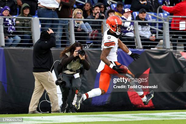 Greg Newsome II of the Cleveland Browns celebrates returning an interception for a touchdown against the Baltimore Ravens during the fourth quarter...