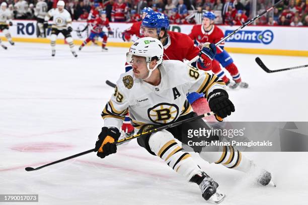 David Pastrnak of the Boston Bruins skates during the third period against the Montreal Canadiens at the Bell Centre on November 11, 2023 in...