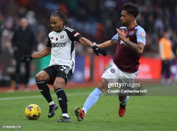 Bobby Reid of Fulham on the ball whilst under pressure from Boubacar Kamara of Aston Villa during the Premier League match between Aston Villa and...