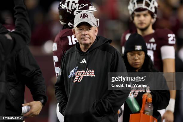 Offensive coordinator Bobby Petrino of the Texas A&M Aggies watches players warm up before the game \am at Kyle Field on November 11, 2023 in College...
