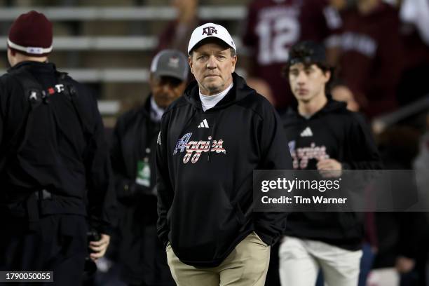 Head coach Jimbo Fisher of the Texas A&M Aggies watches players warm up before the game against the Mississippi State Bulldogs at Kyle Field on...