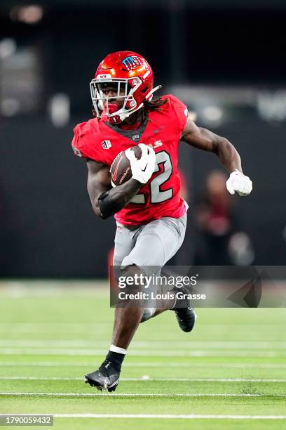 Jai'Den Thomas of the UNLV Rebels runs the ball in the second half of a game against the Wyoming Cowboys at Allegiant Stadium on November 10, 2023 in...