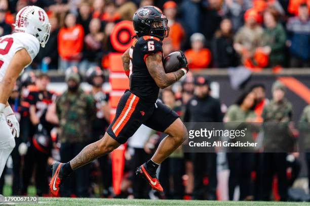 Running back Damien Martinez of the Oregon State Beavers rushes the ball into the end zone for a touchdown during the first half of the game against...