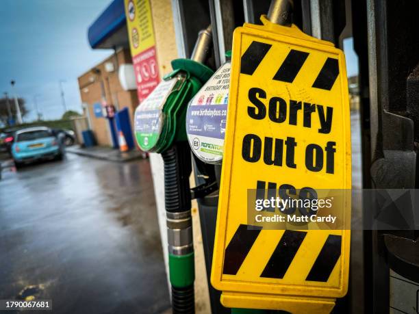 Sorry out of use sign is displayed on a petrol pump at a filling station, on November 12, 2023 in Weston-super-Mare, England.