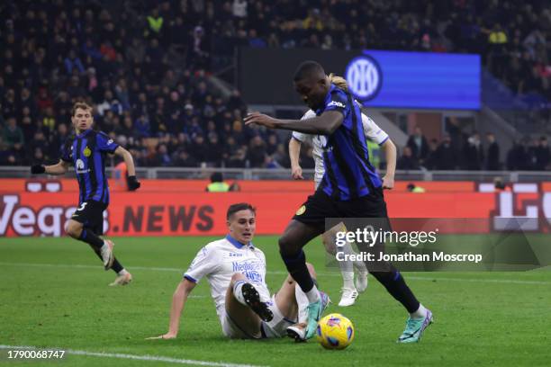 Marcus Thuram of FC Internazionale is upended by Ilario Monterisi of Frosinone Calcio to earn his side a penalty after dribbling his way through the...