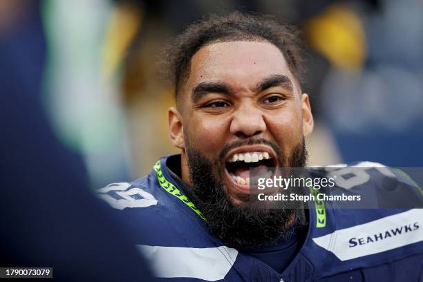 Leonard Williams of the Seattle Seahawks celebrates after a sack during the second quarter against the Washington Commanders at Lumen Field on...
