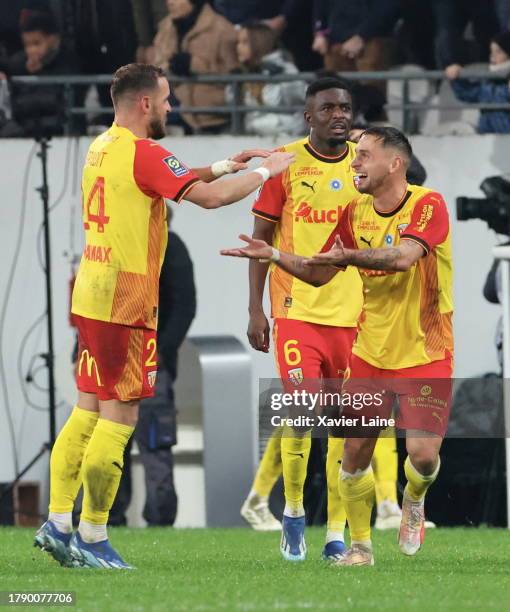 Jonathan Gradit of RC Lens celebrates his first goal with Ruben Aguilar and Salis Abdul Samed during the Ligue 1 Uber Eats match between RC Lens and...