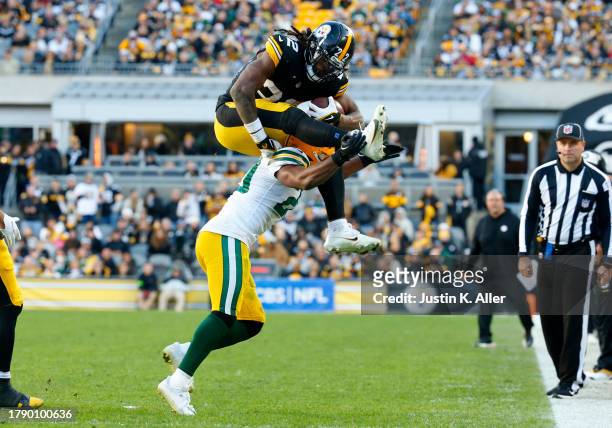 Najee Harris of the Pittsburgh Steelers in action against Rudy Ford of the Green Bay Packers on November 12, 2023 at Acrisure Stadium in Pittsburgh,...