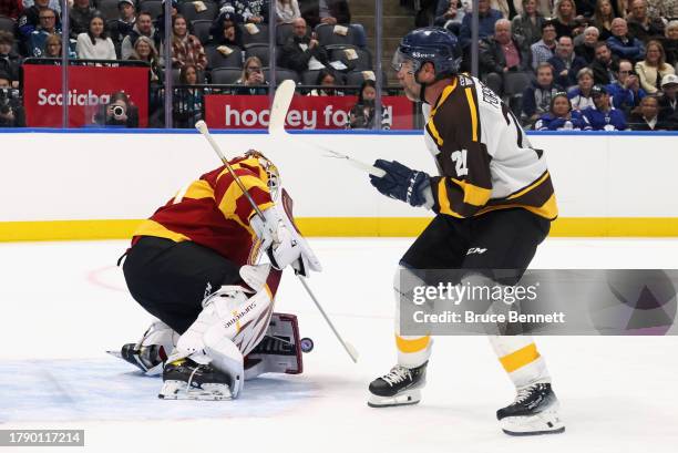 Henrik Lundqvist stops the last shot of the shootout against Peter Forsberg during the Hockey Hall of Fame Legends Classic Game at Air Canada Centre...