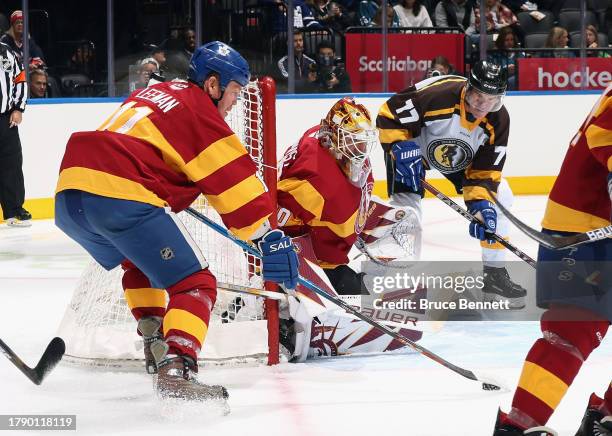 Henrik Lundqvist tends net against Pierre Turgeon in the Hockey Hall of Fame Legends Classic Game at Air Canada Centre on November 12, 2023 in...