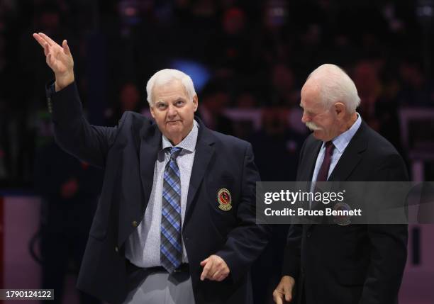 Ken Hitchcock is given his Hockey Hall of Fame blazer from Lanny McDonald at Air Canada Centre on November 12, 2023 in Toronto, Ontario, Canada.