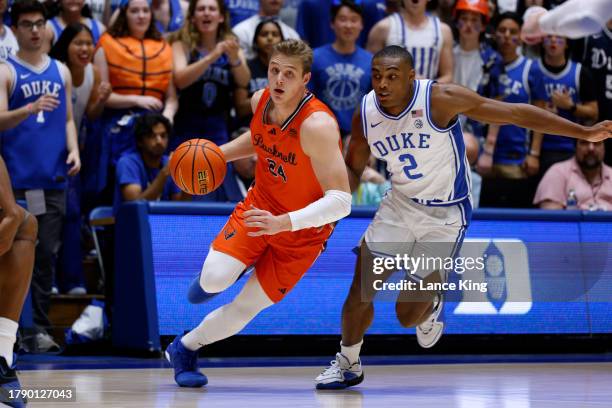 Jack Forrest of the Bucknell Bison drives against Jaylen Blakes of the Duke Blue Devils at Cameron Indoor Stadium on November 17, 2023 in Durham,...