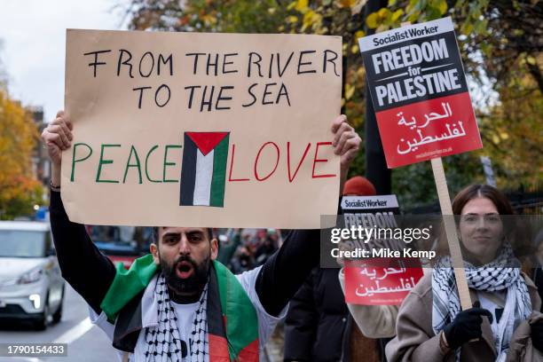 Protester holds up a placard which reads 'From the river to the sea, peace and love' following last weekends pro-Palestinian ceasefire now...