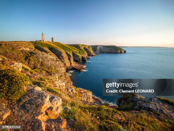 wide angle elevated view of the sandstone cliffs of the cap frehel (fréhel) at the golden hour, cotes-d'armor, brittany (bretagne), western france. - cap fréhel stock pictures, royalty-free photos & images