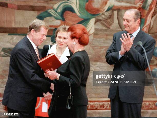 French President Jacques Chirac applauds Czech president Vaclav Havel receiving the Cino Del Duca literary prize from the hands of Simone Del Duca at...