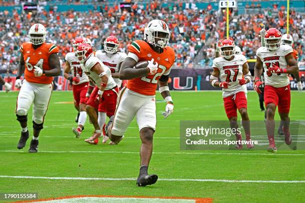 Miami running back Mark Fletcher, Jr. Carries the ball 22 yards for a touchdown in the first quarter as the Miami Hurricanes faced the Louisville...
