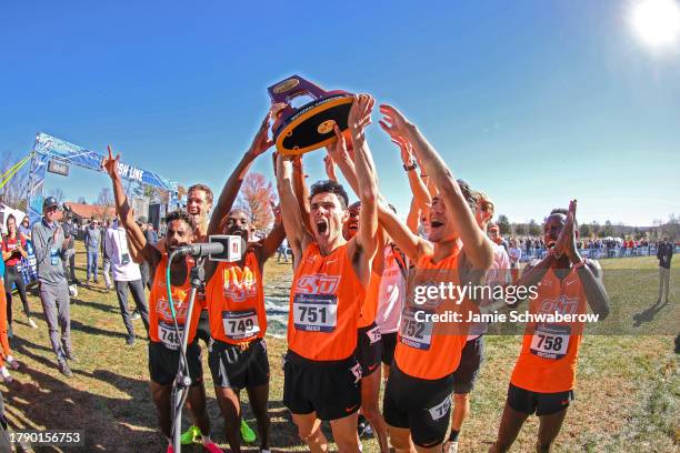 The Oklahoma State Cowboys celebrate during the Division I Men's and Women's Cross Country Championship held at Panorama Farms on November 18, 2023...