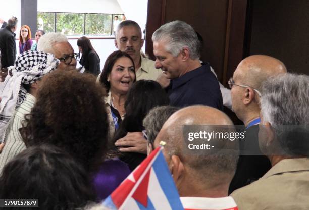 This frame grab from AFPTV video footage shows Cuban President Miguel Díaz Canel talking with participants of the IV Nation and Emigration Conference...