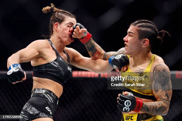 Jessica Andrade of Brazil punches Mackenzie Dern in a strawweight fight during the UFC 295 event at Madison Square Garden on November 11, 2023 in New...